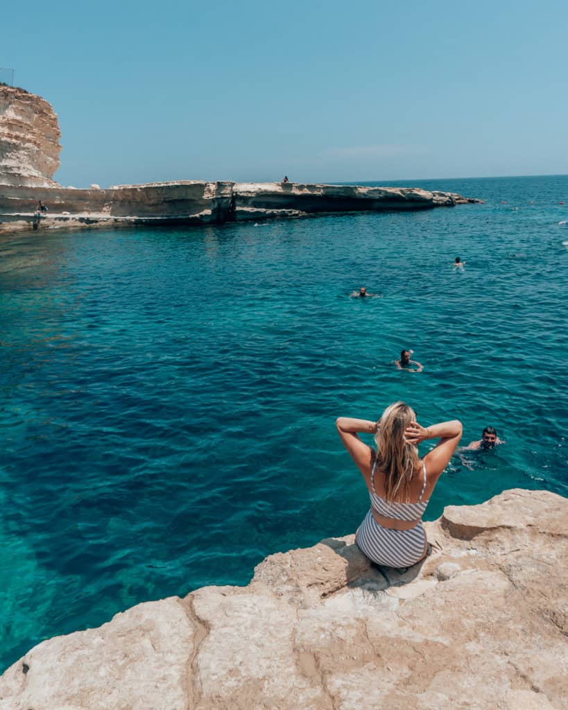 girl on edge of St. Peter's Pool, what to see in Malta
