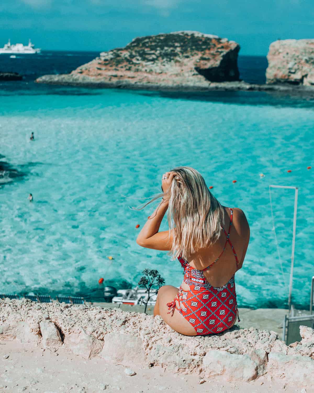 Girl overlooking the blue lagoon