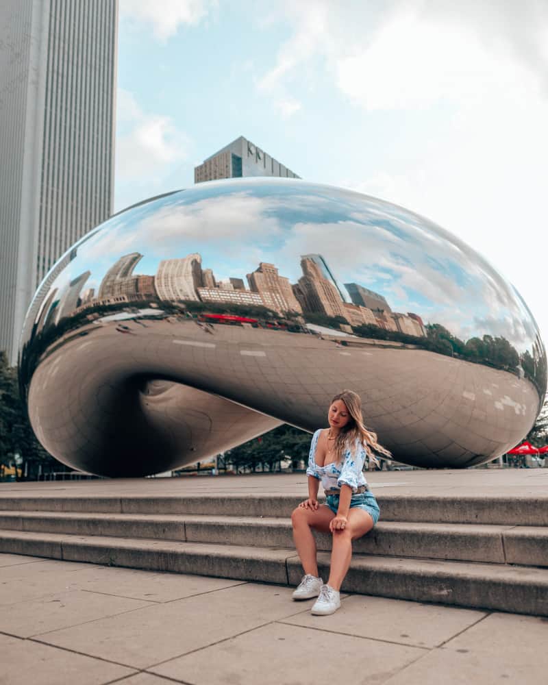 girl sitting in front of the bean