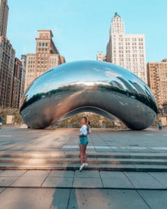 girl standing in front of the Bean