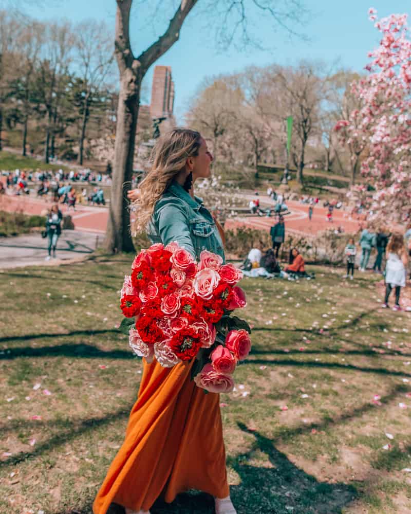 holding bouquet in Central Park one of the best Instagram spots in NYC