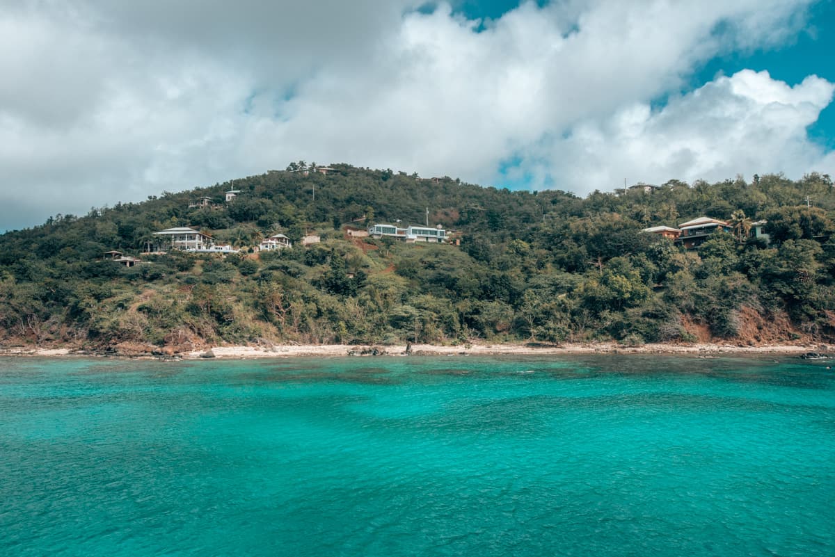 turquoise water will mountain in background