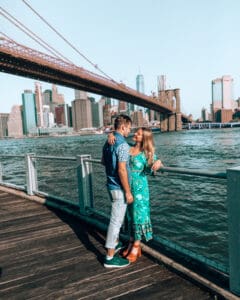 couple standing at dumbo waterfront