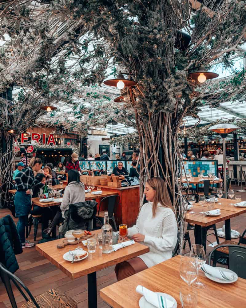 girl sitting at restaurant table with winter decor
