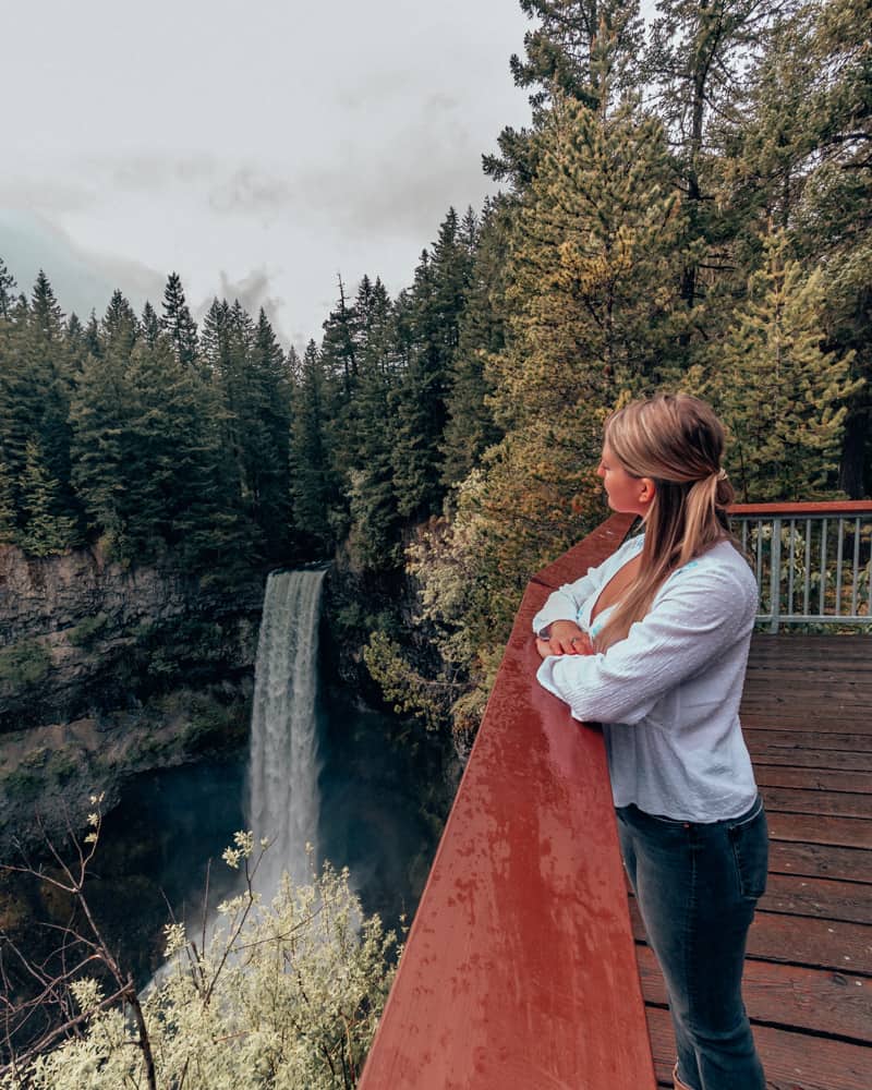 girl looking at waterfall