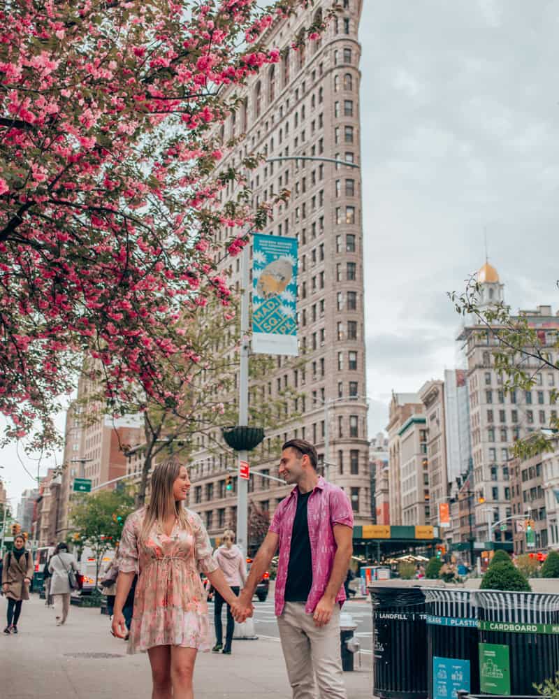 couple standing in front of the flatiron building