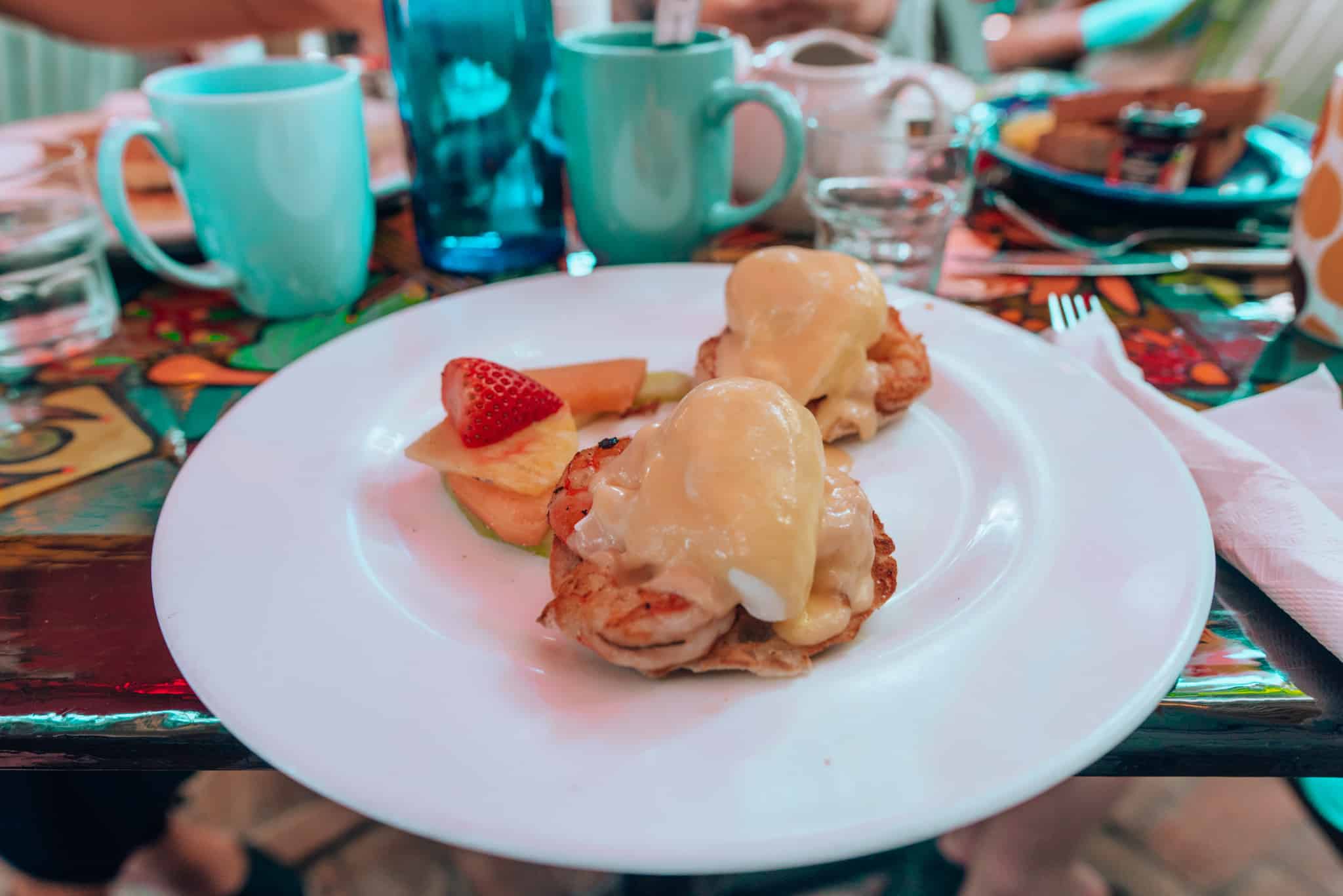 eggs Benedict on white plate
