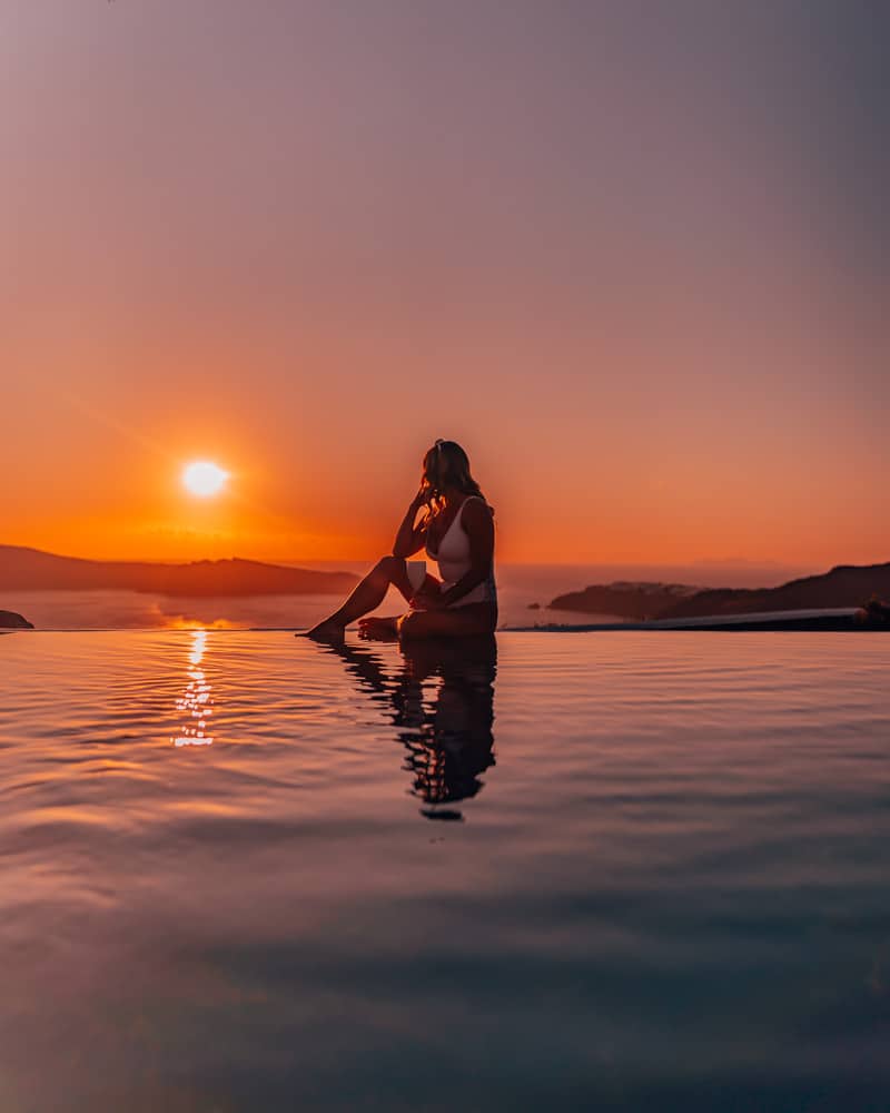 infinity pool orange sunset