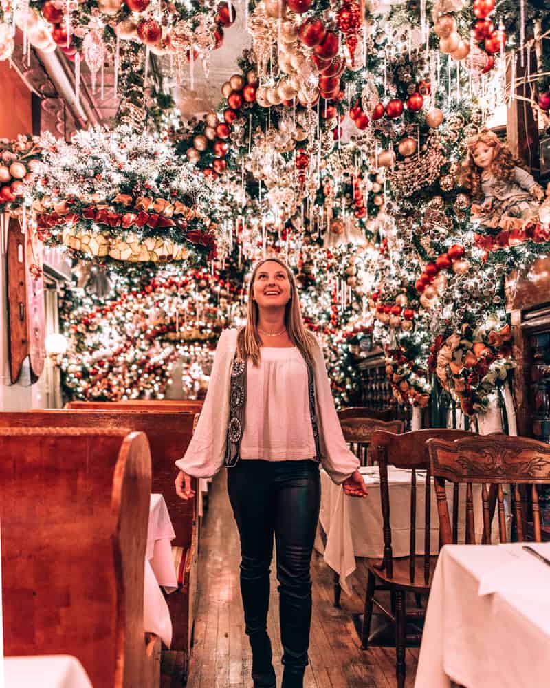 girl standing in restaurant with Christmas decorations