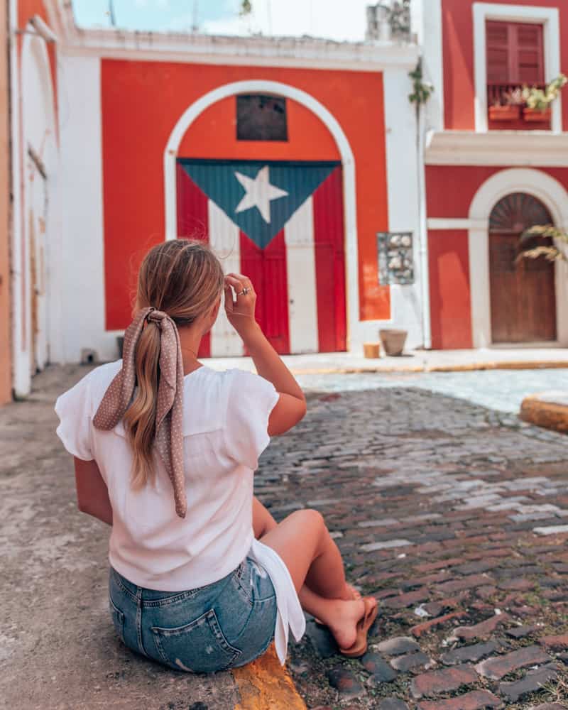 girl sitting on a street corner