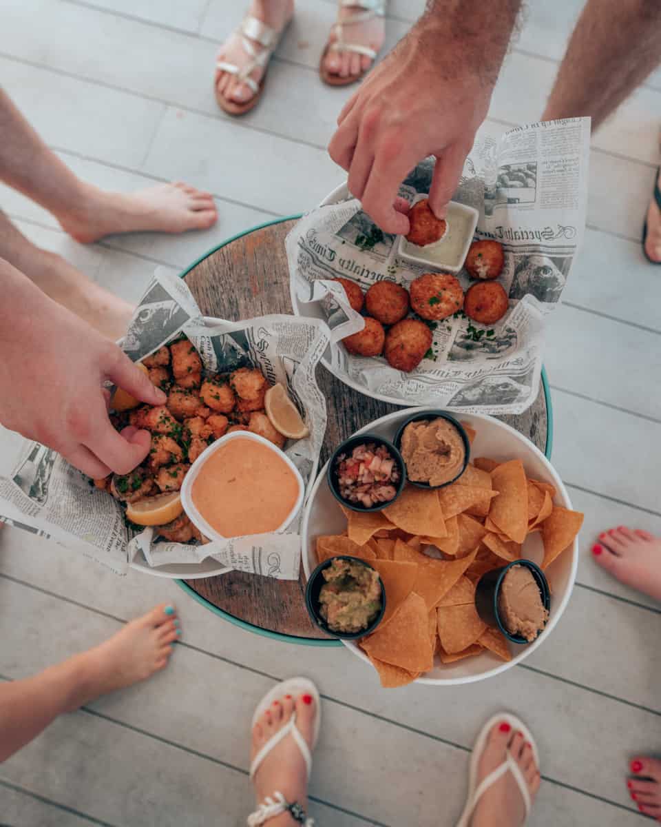 hands grabbing food