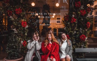 3 girls in front of boutique