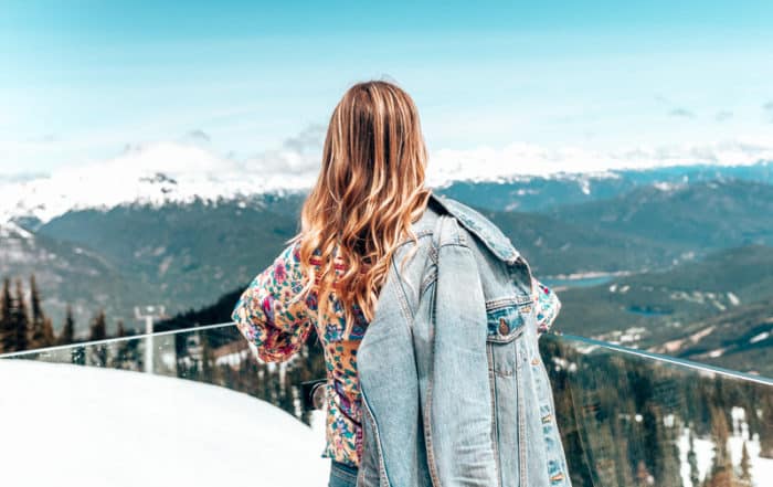 girl standing at whistler peak