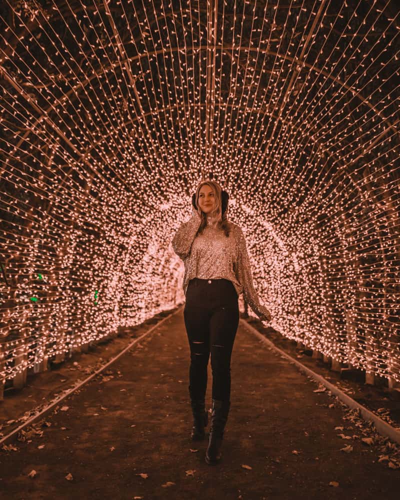 girl standing in light tunnel