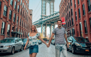 couple in front of Manhattan bridge